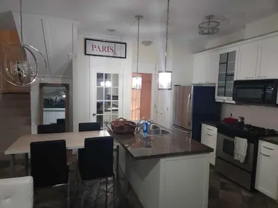 a kitchen with a sink and a counter top at Central Townhouse Richards Street in Vancouver