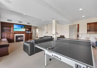 a living room with a ping pong table at Full House with Amazing Okanagan Views and Hot Tub in Kelowna