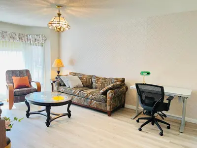a living room with a couch and a table at Entire 6BED house easy to Banff & DT, Winsport in Calgary