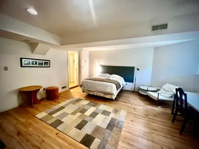 a bedroom with a bed and a table in it at Beautiful and cozy room in Vancouver in Vancouver
