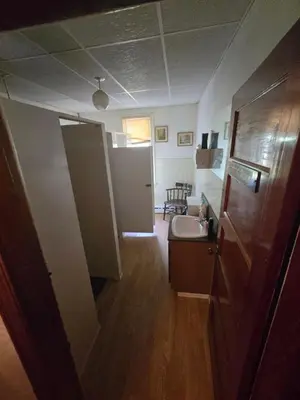 a small bathroom with a sink and a mirror at Coal Branch Hotel & Restaurant