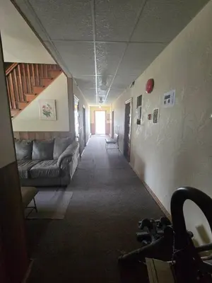 a hallway with a couch in a room at Coal Branch Hotel & Restaurant