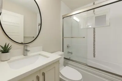 a bathroom with a sink and a mirror at Spacious 4BD Home in Vancouver in Vancouver