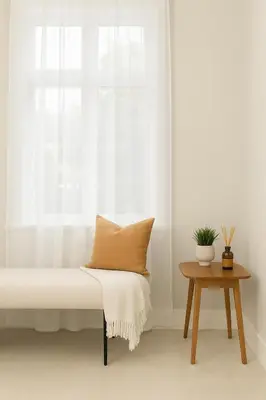 a bench with a pillow next to a window at Spacious 4BD Home in Vancouver in Vancouver