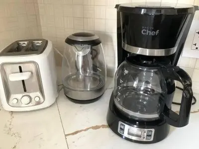 a coffee maker and a blender on a counter at 5 Min to Southgate Mall and U of A, Bright and Private, Cool Summer Stay in Edmonton
