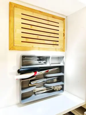 a drawer filled with utensils in a kitchen at 5 Min to Southgate Mall and U of A, Bright and Private, Cool Summer Stay in Edmonton