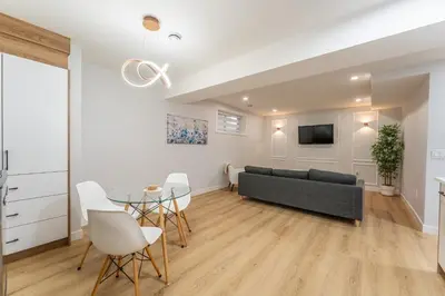 a living room with a couch and a table at New 1 bdr basement apartment in Calgary