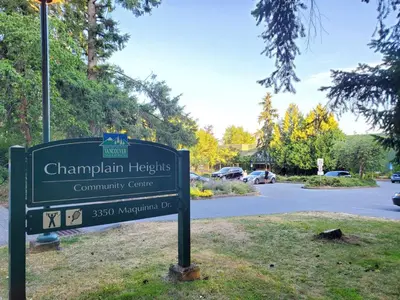a sign for the champlain heights community centre at Maplewood Hostel in Vancouver