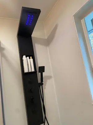 a black shelf with a microphone on a wall at Beachbreeze Panoramic Oceanview 5BR 4BA Romantic Sunrise & Celestial Views in Mill Bay