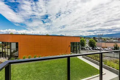 a view of a building from a balcony at Gyro Beach Vacations in Kelowna