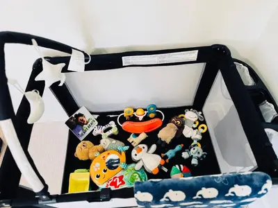 a opened bag filled with stuffed animals and toys at Cozy house with 4 Bedrooms 3 Full bath and 1 half bath in Calgary