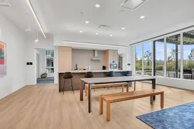 a kitchen and living room with a table and chairs at New condo Great amenities Near Skytrain in Coquitlam