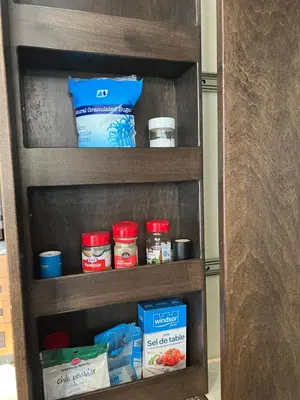 a book shelf with food items on it at A Gorgeous Mansion for Jasper Vacation in Hinton