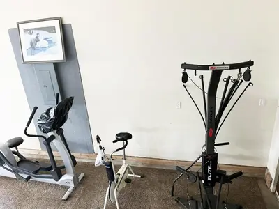 a room with two exercise bikes and a treadmill at A Gorgeous Mansion for Jasper Vacation in Hinton