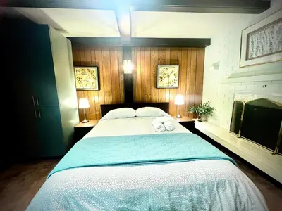 a bedroom with a large bed with two towels on it at Luxury Space close to UBC in Vancouver