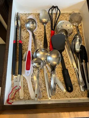 a drawer filled with spoons and other kitchen utensils at A Gorgeous Mansion for Jasper Vacation in Hinton