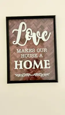 a picture of a sign that reads pec makes our house a home at Red Deer Stay- 2BR Private Suite in Red Deer