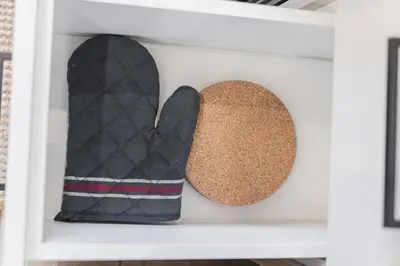 two mittens and a rock on a shelf at Chic Garden Suite Hideaway 2Bedroom Games Room in Edmonton