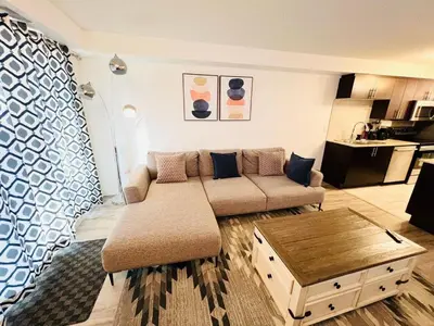 a living room with a couch and a coffee table at Mordern 2BedRoom Downtown Apt with Free Parking & Wifi in Edmonton