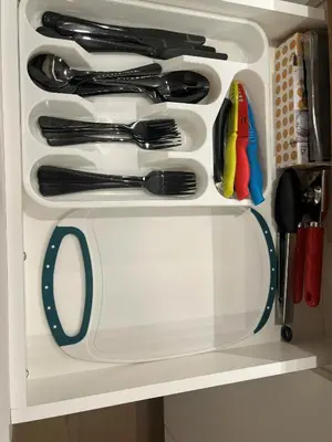 a white drawer with utensils in it at Cedar & Sage Suite the Cozy Retreat with Full Kitchen in Victoria