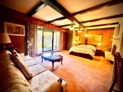 a living room with a couch and a bed at Comfortable private room near UBC-B in Vancouver