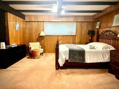 a bedroom with a bed and a desk and a chair at Comfortable private room near UBC-B in Vancouver