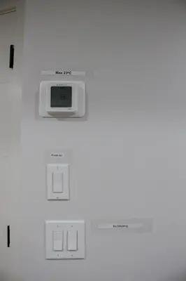 a white wall with a clock on a wall at Modern 2 Beds 1 Bath Private Suite, Close to mountains in Calgary