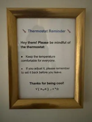 a picture of a framed poem in a wooden frame at Luxurious Air Conditioned Inner City Bungalow in Calgary