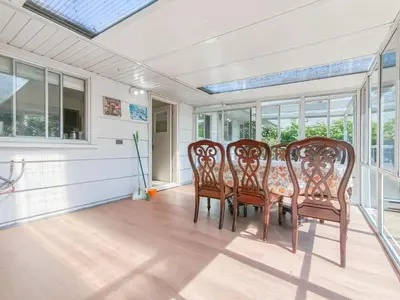 a dining room with a table and chairs at Cozy Airb&b Suite in South Vancouver in Vancouver