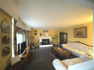 a living room with a couch and a fireplace at Vancouver Richmond Villa39 in Richmond