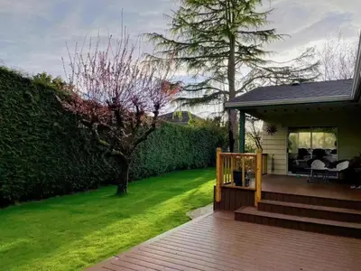 a porch of a house with a green yard at Vancouver Richmond Villa39 in Richmond