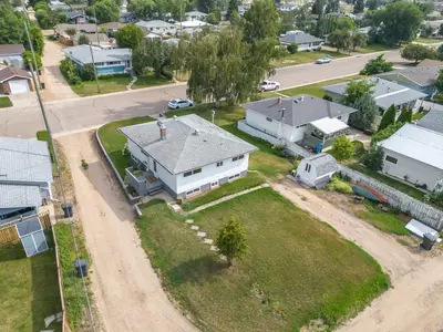 an aerial view of a house in a residential neighborhood at The Coal Stone throw away from Red Deer River 2BR House in Drumheller