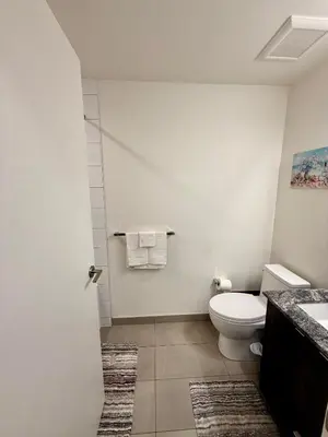 a bathroom with a toilet and a sink at Victoria Colwood Place in Colwood