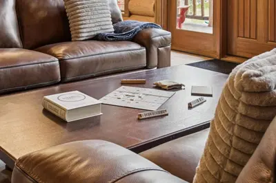 a living room with a couch and a coffee table at Nordegg Timber Estate in Nordegg