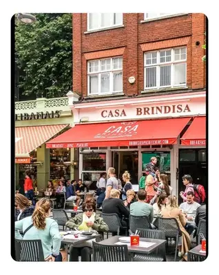 a group of people sitting at an outdoor restaurant at Tania's guest rooms in Calgary