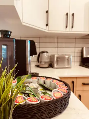 a basket filled with food on a counter in a kitchen at Castle BNB 2025 in Gibsons