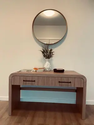 a dressing table with a mirror on a wall at Castle BNB 2025 in Gibsons