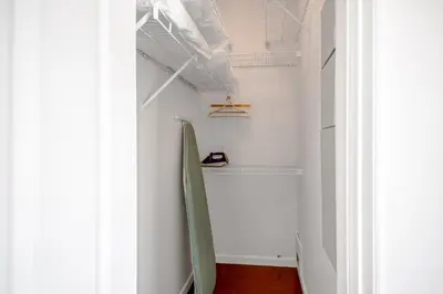 a hallway with a surfboard on the wall at Central Spacious 3 Br Upstairs in Vancouver