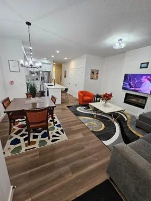 a living room with a couch and a table at Family Friendly in Calgary