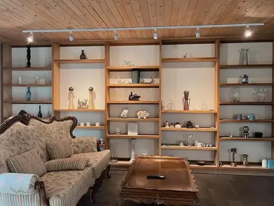 a living room with a couch and shelves ofiques at Sunshine garden 5 bedrooms2 living rooms3 bathrooms1 kitchen in Aldergrove