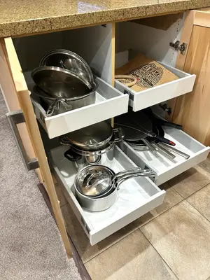 a kitchen drawer with pots and pans in it at XL Luxury Penthouse Ski-in Ski-out The Aspens in Whistler