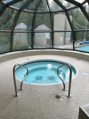 a hot tub in an igloo with a glass ceiling at Quiet & Cozy Ski-In Out, Hot tub, pool in Whistler