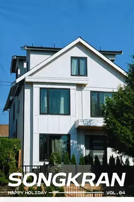 a white house with a happy holidays sign in front of it at Roger & May's Cabin in Vancouver