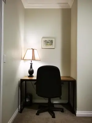 a desk with a chair and a lamp on it at Eagle's House, Room #1 in Victoria