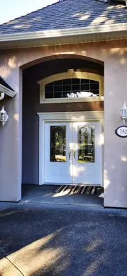 a white front door of a house at Eagle's House, Room #1 in Victoria