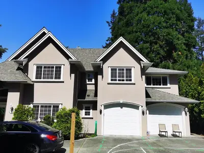 a house with a car parked in front of it at Eagle's House, Room #2 in Victoria