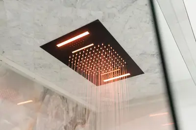 a light hanging from the ceiling in a room at Blue Spruce Den - Vernon in Vernon