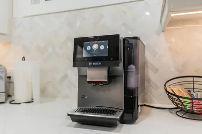 a coffee maker on a counter next to at Blue Spruce Den - Vernon in Vernon