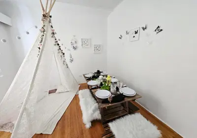 a dining room with a table and a tent at Private 2 BR Cozy Home Private Parking Free Sparkling and Goodies! 4 mins from Metrotown in Burnaby