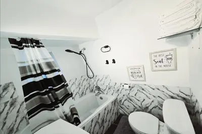 a bathroom with a toilet and a sink at Private 2 BR Cozy Home Private Parking Free Sparkling and Goodies! 4 mins from Metrotown in Burnaby